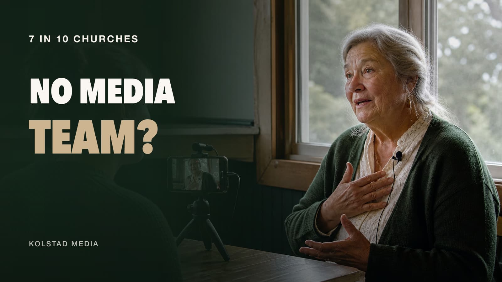 A volunteer filming an older church member on a phone with the words No Media Team