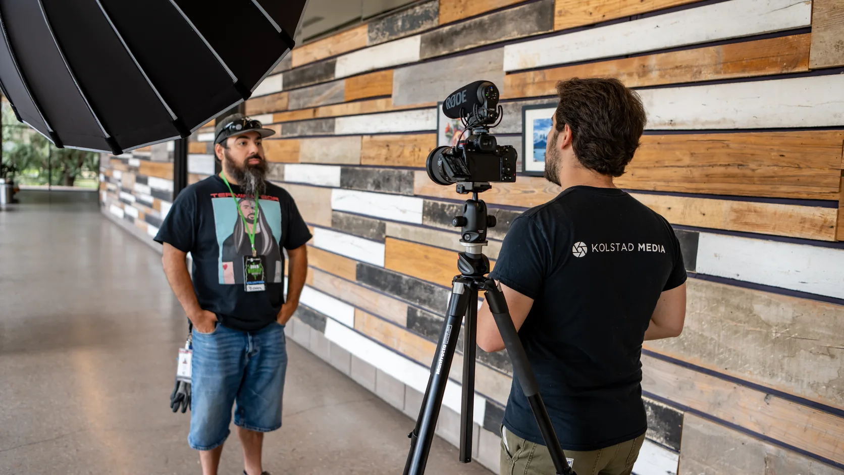 A Kolstad Media crew member filming an on-location interview