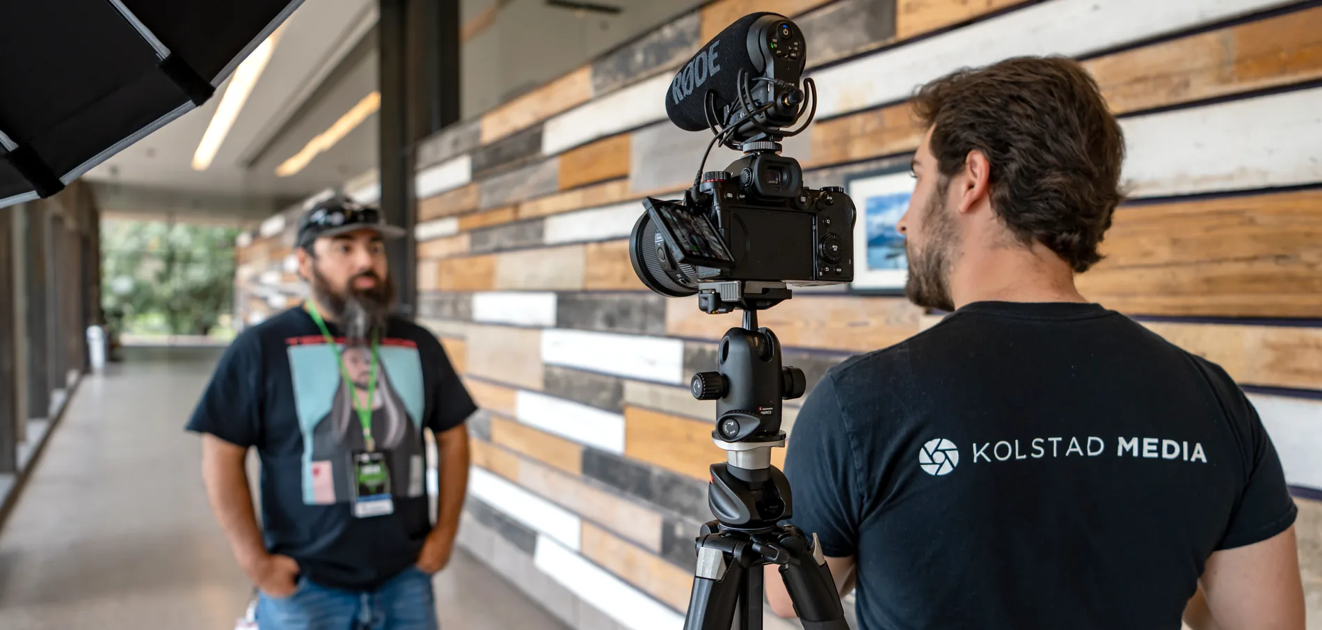 Caleb Kolstad filming an interview on location